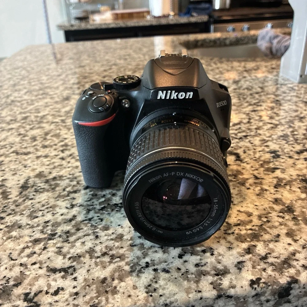 Nikon Black Digital Camera with Ergonomic Design and Professional Lens